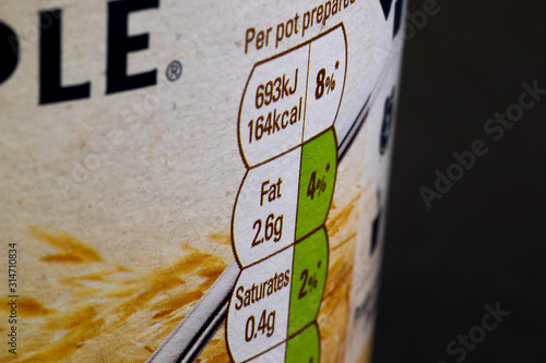 Fat content information displayed on food packaging label with shallow depth of field