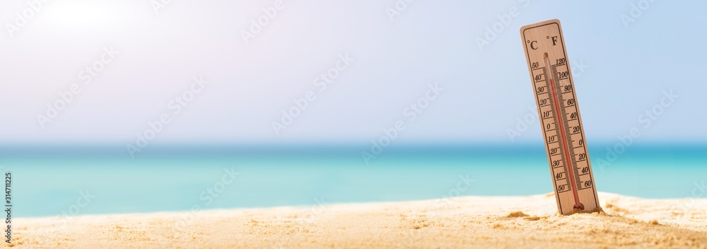 Close-up Of Thermometer On Sand - obrazy, fototapety, plakaty 