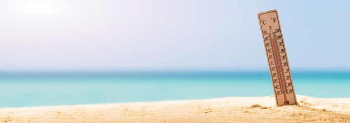 Close-up Of Thermometer On Sand