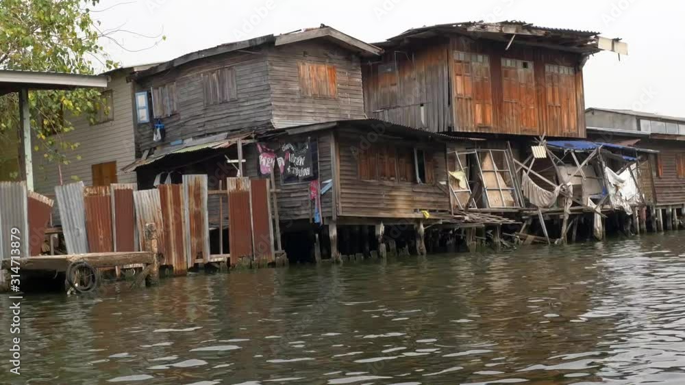 House on a canal, Rim klong house long shot House on a canal, Rim klong house long shot