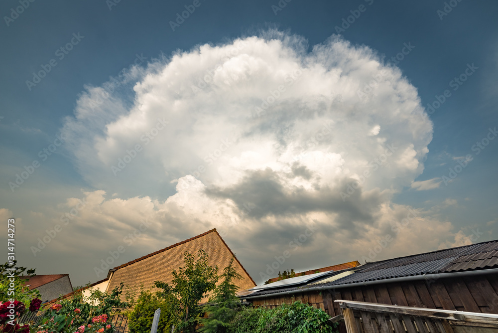 Thunderstorm with strong updraft and out spreading anvil Thunderstorm with strong updraft and out spreading anvil