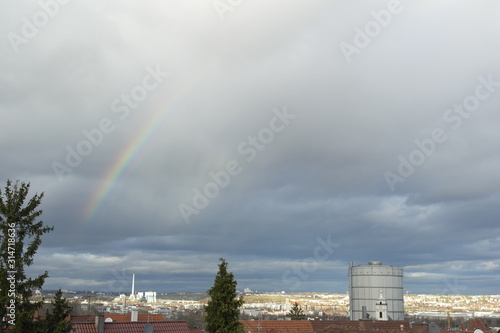 Ein kleines Stück Regenbogen über Stuttgart mit dem Gaskessel und der Gaisburger Kirche photo