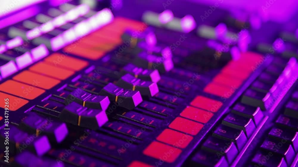 the illuminator's hand sets up the mixing light console and prescribes programs in multi-colored lighting the illuminator's hand sets up the mixing light console and prescribes programs in multi-colored lighting