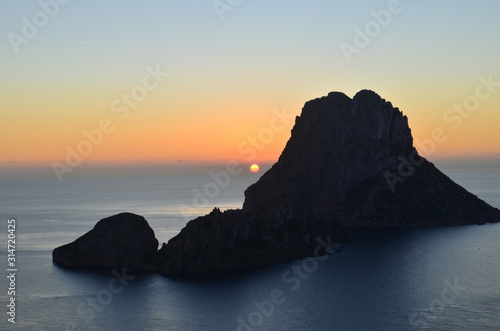 sunset on the horizon of the Mediterranean Sea between islets of Ibiza  Spain