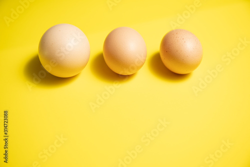 Fresh Easter Eggs on a Yellow Background. Happy Easter