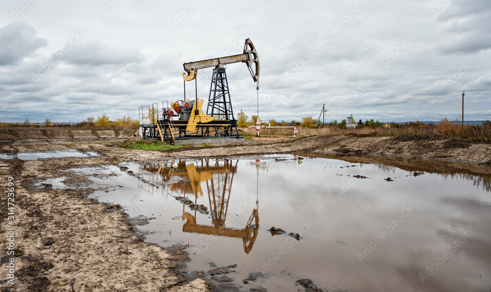 Oil pumps. Oil rocking chair. Equipment for the oil industry. Industrial landscape Oil pumps. Oil rocking chair. Equipment for the oil industry. Industrial landscape