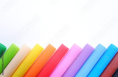 Colorful pens isolated on white background close-up