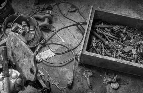 Black and white still life with artist's palette, spoon, and junk drawer