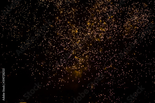 Celebratory colorful fireworks light up the night sky. closeup. New year