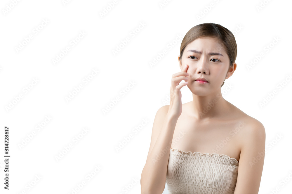 Portrait of a beautiful Asian woman touches her face concerned about small pimple, blemish, large pores, combination, oily, sensitive skin, concept face beauty, cosmetology, skin care concept. Portrait of a beautiful Asian woman touches her face concerned about small pimple, blemish, large pores, combination, oily, sensitive skin, concept face beauty, cosmetology, skin care concept.