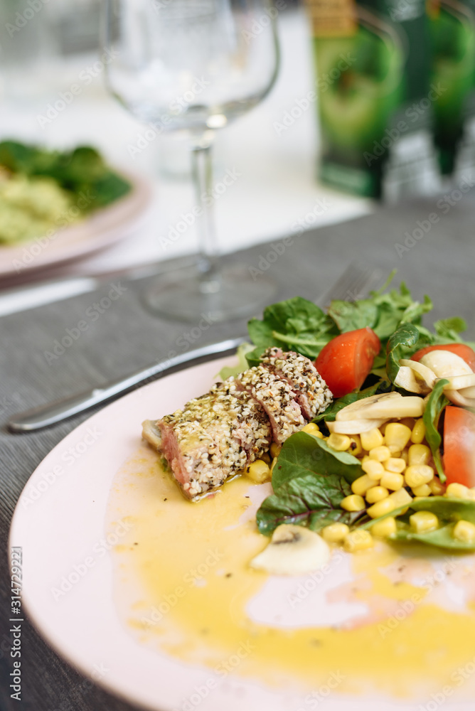 Salad of greens, canned corn and fried tuna in sesame seeds. Recipe for an expensive fish Salad of greens, canned corn and fried tuna in sesame seeds. Recipe for an expensive fish