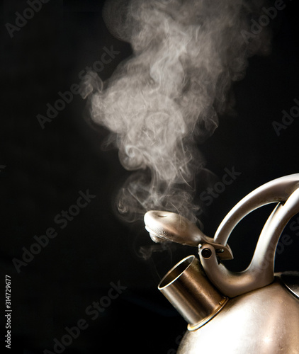 Boiling cattle with steam on black background