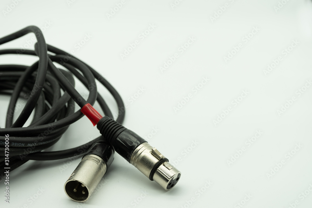 black xlr cable on white background, music concept black xlr cable on white background, music concept