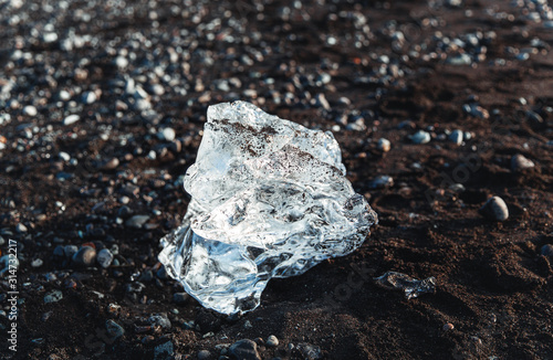 A glacier ice cube was melted and found on Diamond Beach in Iceland