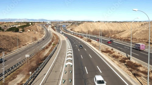 Generic highway overpass long exposure with cars. Captured in outskirts of Madrid, Spain. Deliberate motion blur photo