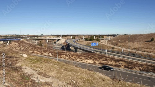 Generic highway overpass long exposure with cars. Captured in outskirts of Madrid, Spain. Deliberate motion blur photo