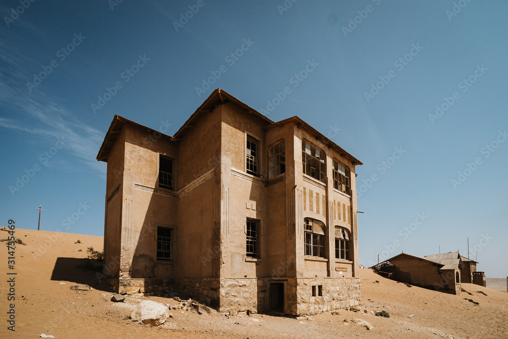 abandoned big house on a high desert plain