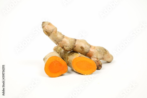 Fresh turmeric isolated on a white background is used as a tonic for the body and food ingredients.