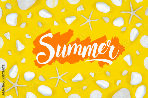 Summer lettering sign. Calligraphic text surrounded by starfishes and rocks on a vibrant yellow background. Top view