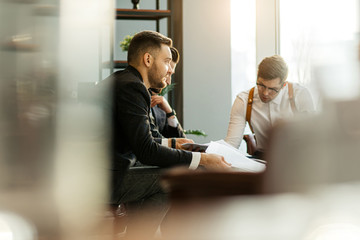 successful business partners coworking in office, caucasian leaders in tuxedo gathered for developing business projects and ideas, frinedly business team at meeting