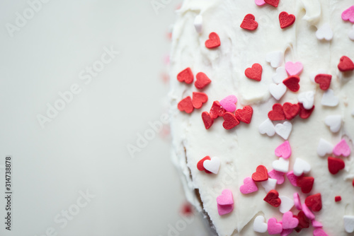Vanilla cake with heart sprinkles for St. Valentin's Day.