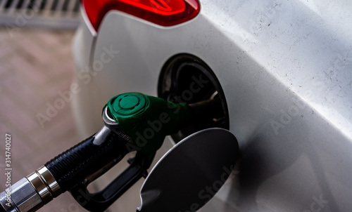 Refueling the machine from a hose at a gas station