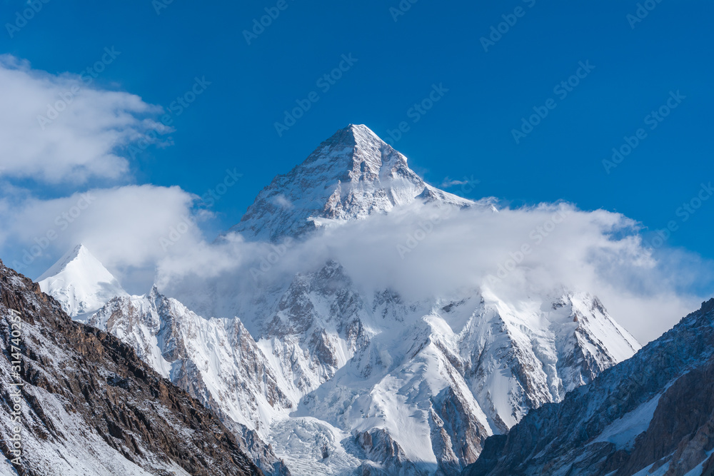 Close up view of K2, the second highest mountain in the world with Angel peak and Nera peak on the left side from Concordia, Pakistan Close up view of K2, the second highest mountain in the world with Angel peak and Nera peak on the left side from Concordia, Pakistan