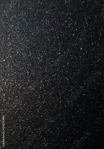 Black sandpaper to make a background image.black glitter texture christmas abstract background
