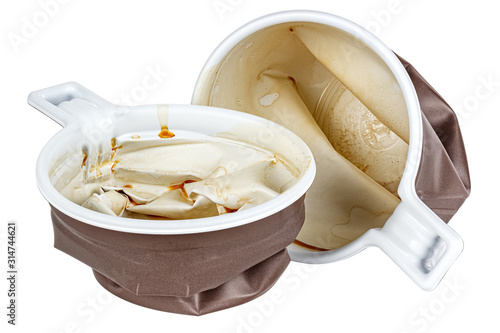 Crushed and crumpled used disposable white plastic mugs with brown satin texture on the outside with coffee stains and smudges isolated on white background