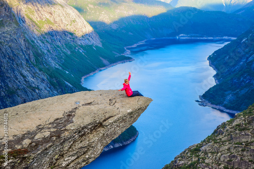 The tourist on the Trolltunga, Norway.