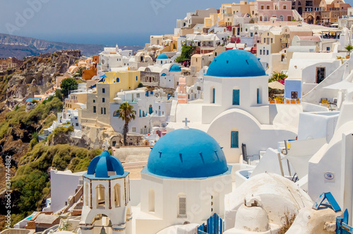 Famous blue dome orthodox church in village of Oia on Santorini island in Greece in Europe. 