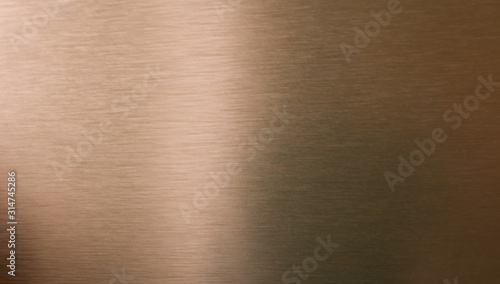 Copper or bronze brushed metal background or texture photo