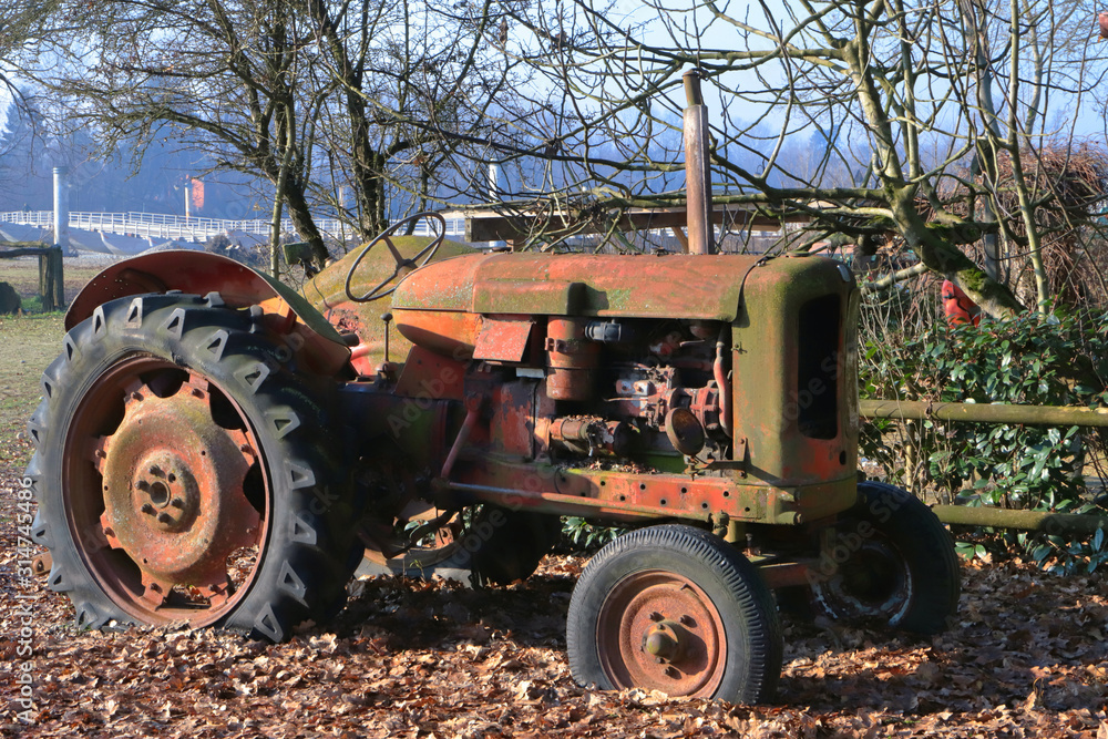 old farm tractor in the countryside old farm tractor in the countryside
