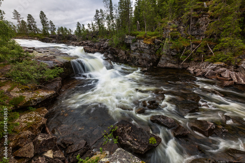 Fototapeta Naklejka Na Ścianę i Meble -  Beautiful landscape of the river and waterfall with long exposure, Norway