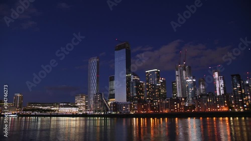 Canary Warf 4K Time-lapse  showing the setting of the dark.Boats on the river.