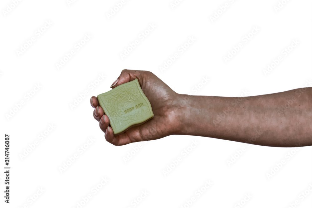 Dirty hand holding natural organic made with olive oil solid green soap bar on white background. Healthy lifestyle, beauty, skin care. Zero waste, plastic free bathroom and home concept. Dirty hand holding natural organic made with olive oil solid green soap bar on white background. Healthy lifestyle, beauty, skin care. Zero waste, plastic free bathroom and home concept.