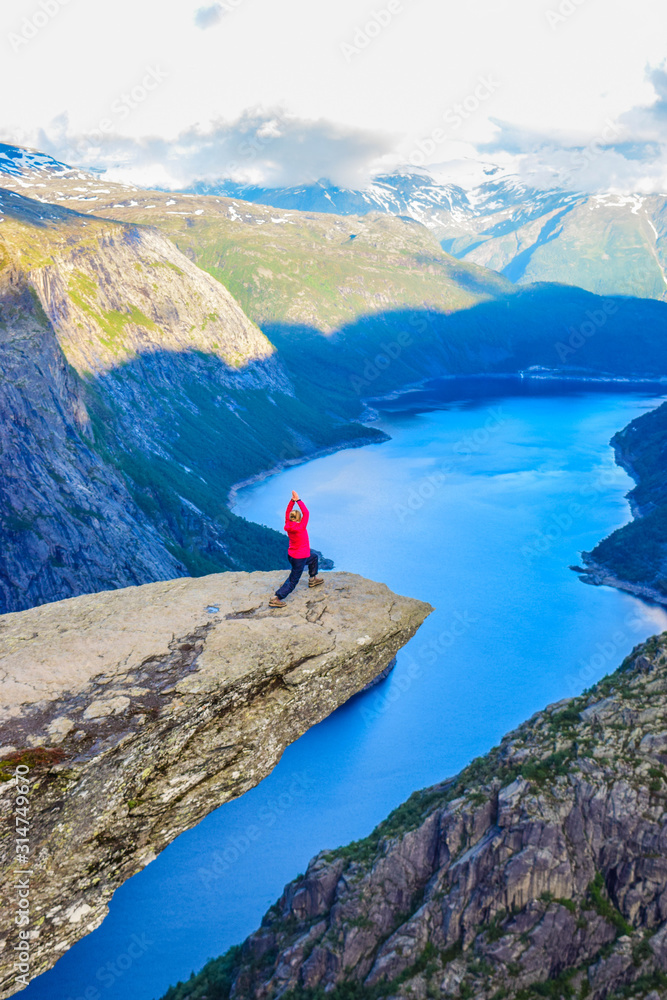 The tourist on the Trolltunga, Norway.