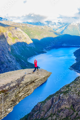 The tourist on the Trolltunga, Norway.