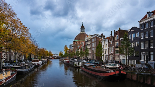 Netherlands - Many Boats in Canal by Cathedral