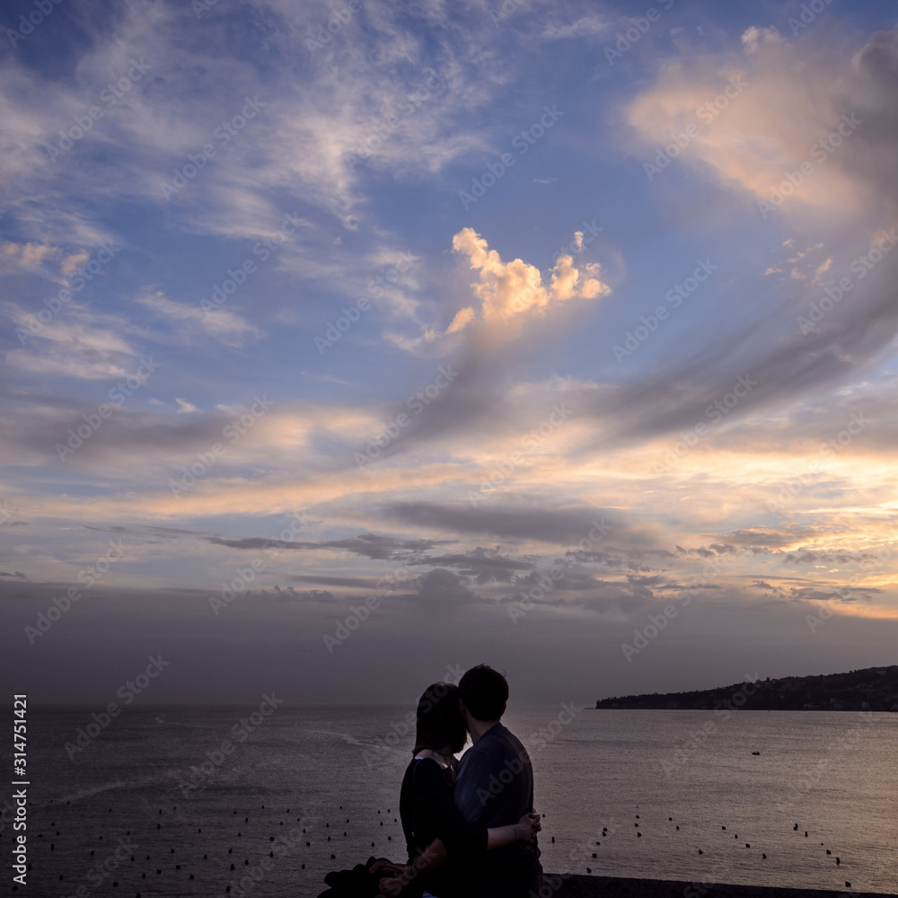 love in the bay of Naples., two lovers look the bay of Naples at sunset.