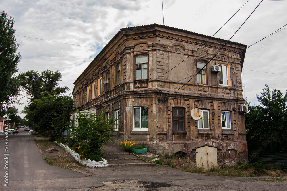 Old two-storey building in Mariupol, Ukraine