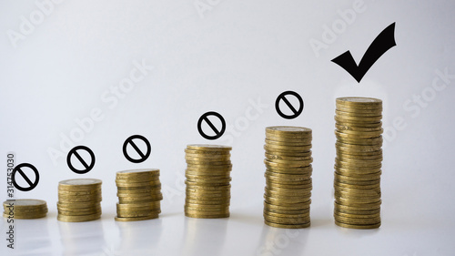 Fotografie Saving and growth concept with metal coins isolated on white background