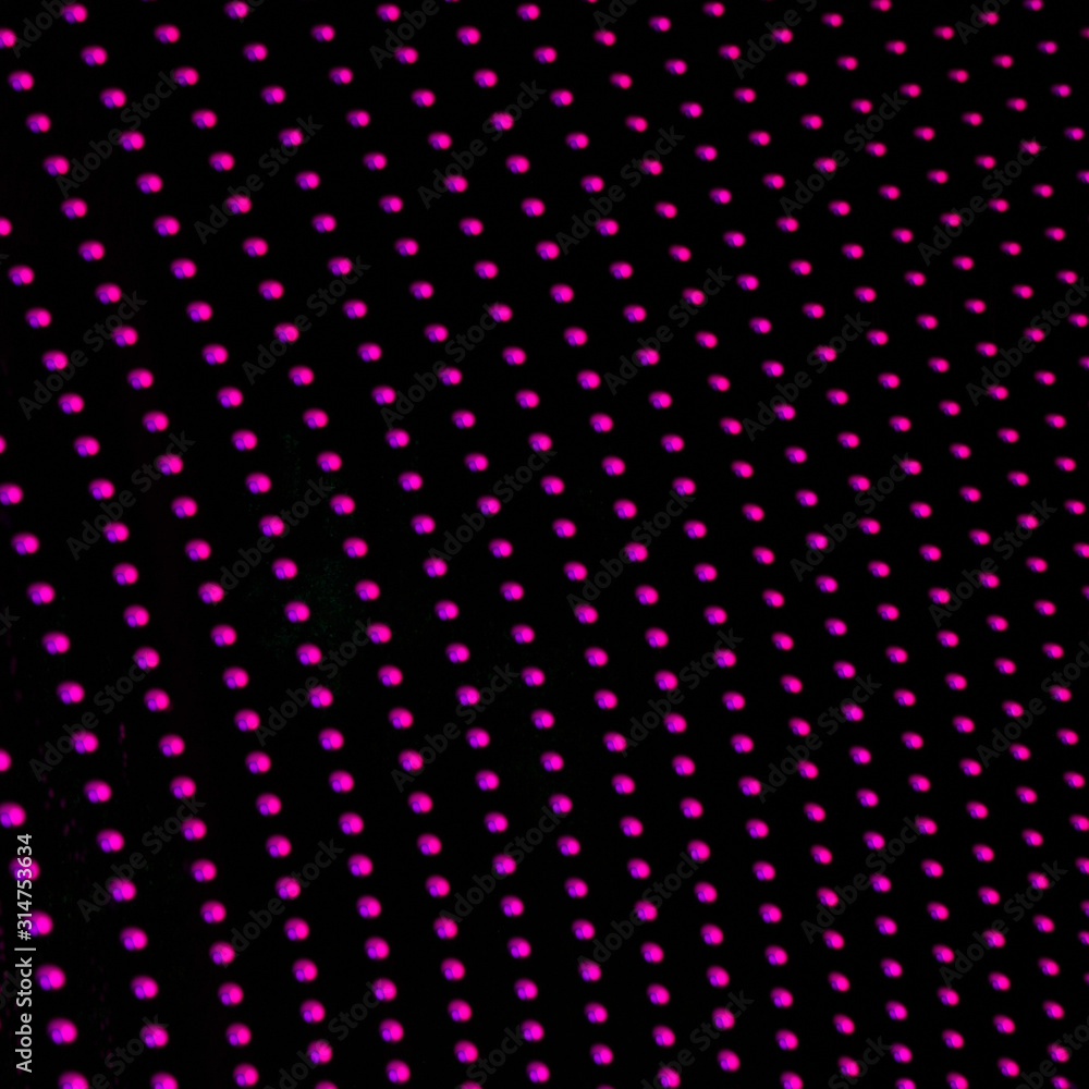 Obraz premium Abstract pink neon dotted pattern. Pink LED lights on black background