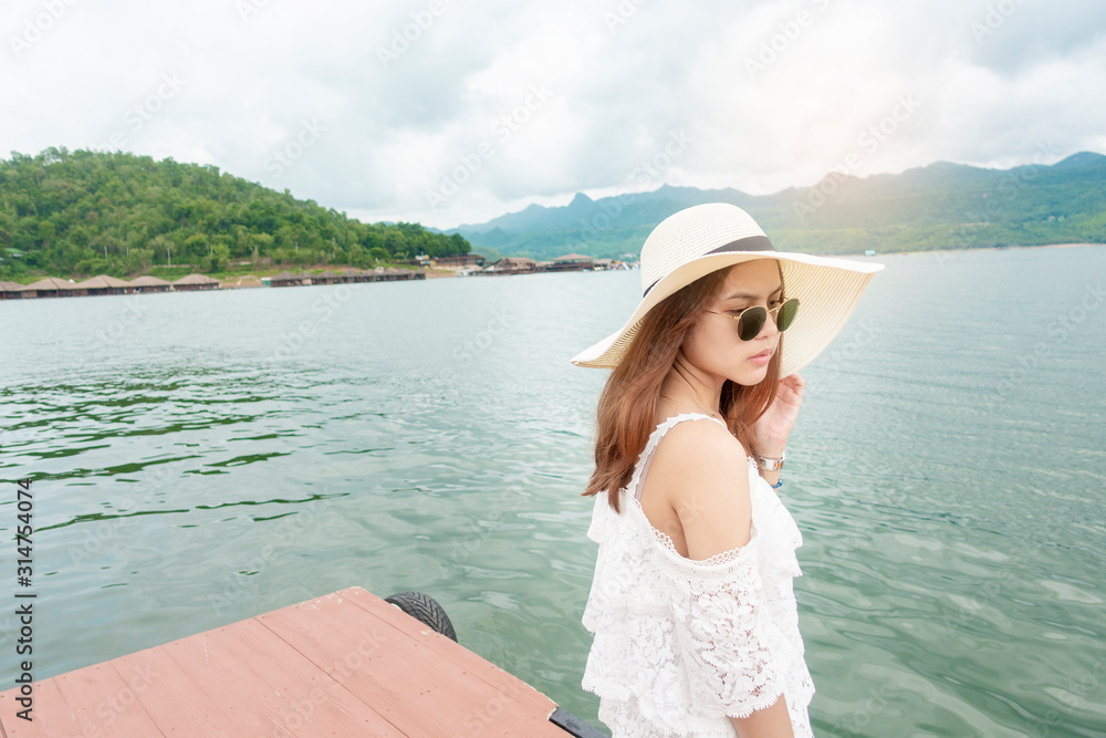 woman enjoying with beautiful lake and mountain woman enjoying with beautiful lake and mountain