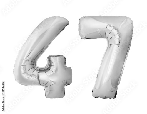 Number 47 forty seven made of silver inflatable balloons isolated on white background. Chrome silver helium balloons forming 47 forty seven number