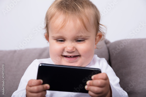 Little Girl With Mobile Phone