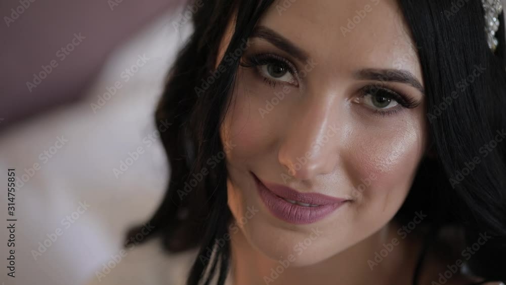 Beautiful and lovely bride in night gown and veil. Wedding morning. Slow motion Beautiful and lovely bride in night gown and veil. Wedding morning. Slow motion