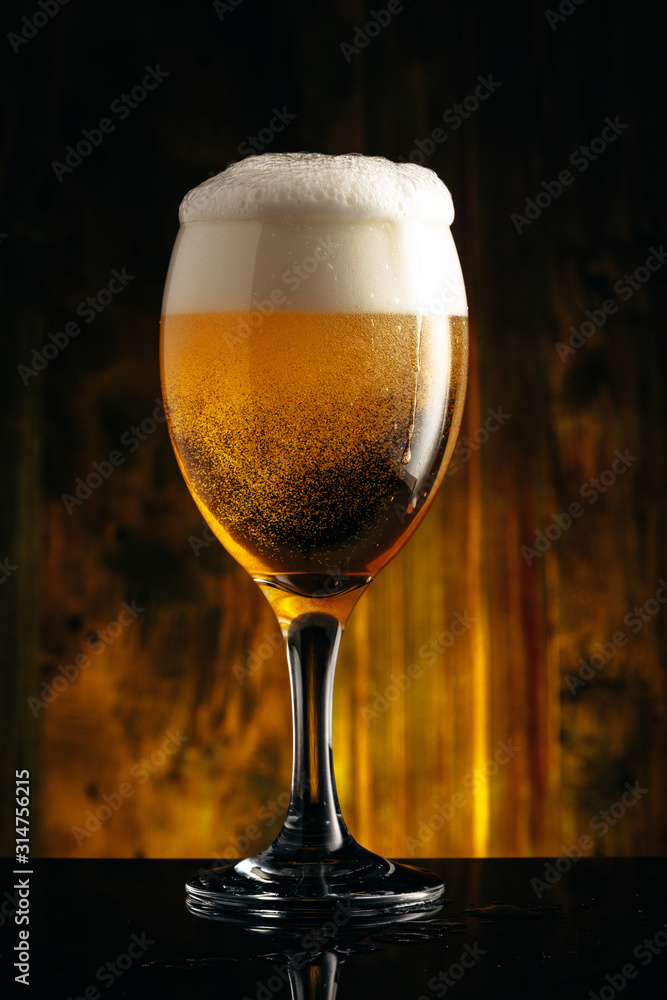 Glass of beer on wooden