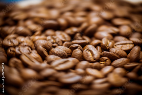 Beans of roasted black coffee. Background. Brown coffee beans, of coffee beans for background and texture.