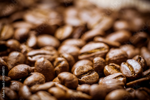 Brown coffee beans, of coffee beans for background and texture. Beans of roasted black coffee. Background.